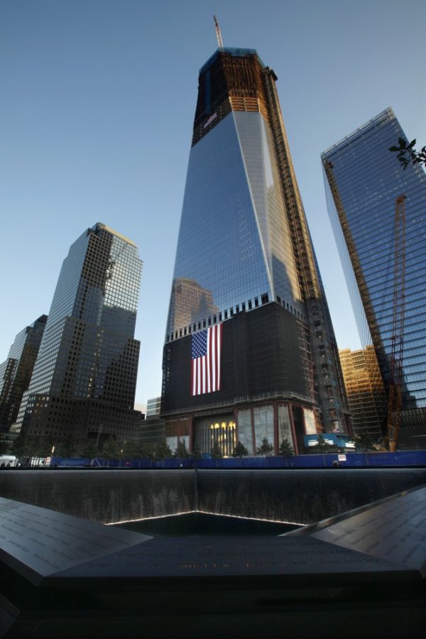 The 9/11 Memorial in New York, New York, was opened to the public for the first time on Monday, September 12, 2011. The north pool of the memorial is in the shadow of the unfinished Freedom Tower. (Carolyn Cole/Los Angeles Times/MCT)