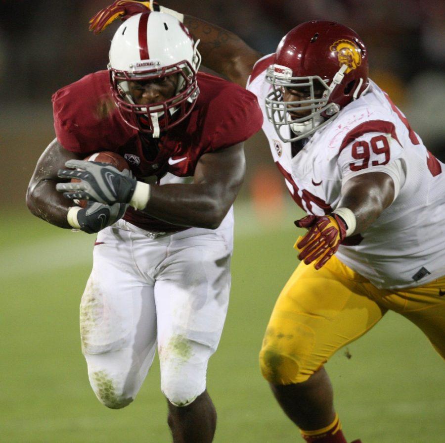 Stanford's Stepfan Taylor eludes Southern California's Antwuan Woods (99) on his way to a touchdown in the third quarter at Stanford Stadium in Stanford, California, on Saturday, September 15, 2012. Stanford knocked off USC, 21-14. (Jim Gensheimer/San Jose Mercury News/MCT)