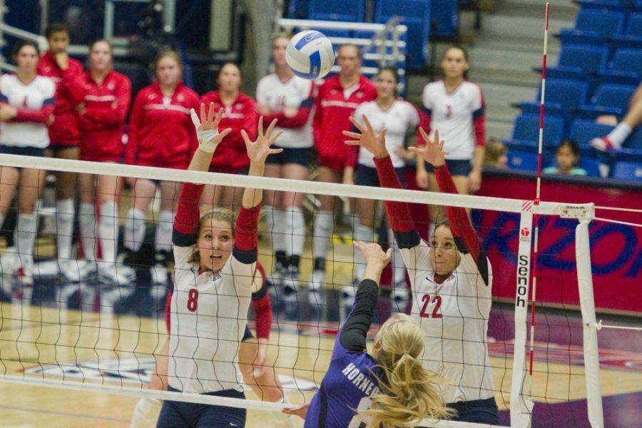 Turki Allugman/Arizona Daily Wildcat

Rachel Rhoades, No. 8, and the UA volleyball team play against TCU last weekend in McKale Center.