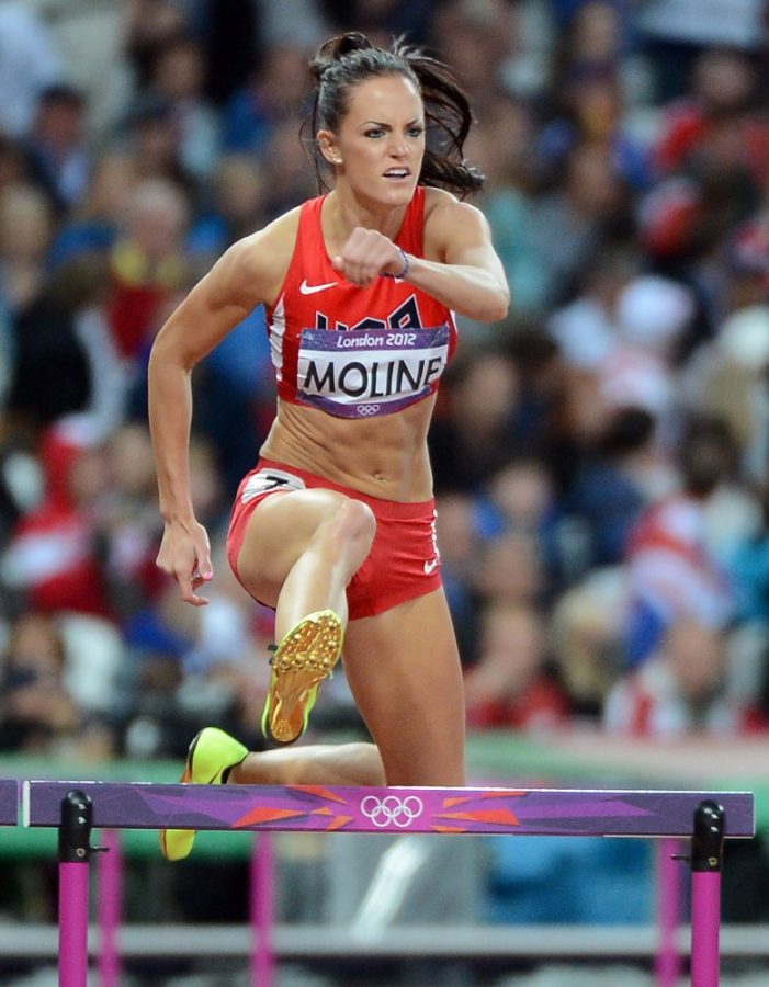 Georganne Moline of the USA clears a hurdle during the third semifinal for the women's 400m hurdles at Olympic Stadium, during the 2012 Summer Olympic Games in London, England, Monday, August 6, 2012. Moline finished second in the semi, and qualified for the final. (Chuck Myers/MCT)