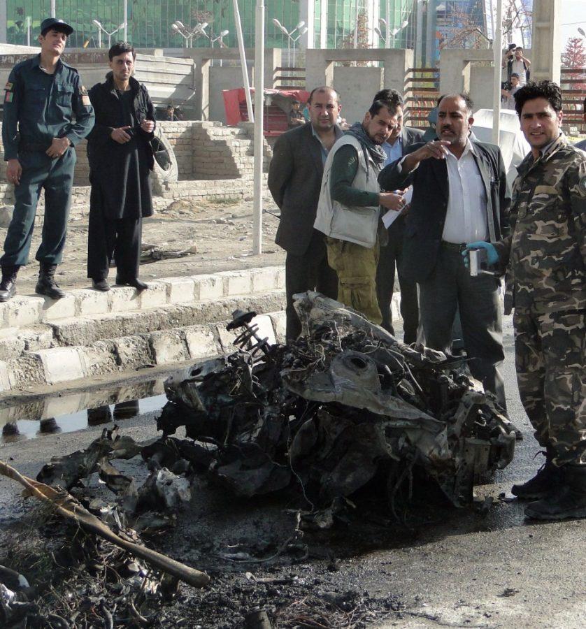Afghan+security+officials+look+at+the+remains+of+a+vehicle+used+in+a+suicide+attack+Tuesday+morning%2C+September+18%2C+2012%2C+near+Kabul+International+Airport+on+a+mini-bus+which+killed+nine+foreigners+%28eight+South+Africans+and+a+Kyrgyzstani+national%29%2C+their+Afghan+driver%2C+and+two+Afghan+bystanders.+%28Ali+Safi%2FMCT%29