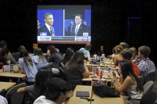 Kevin Brost /  Arizona Daily Wildcat

UA Students watch the presidential debate on a projector screen at a public viewing event held by the ASUA in The Cellar on Tuesday.