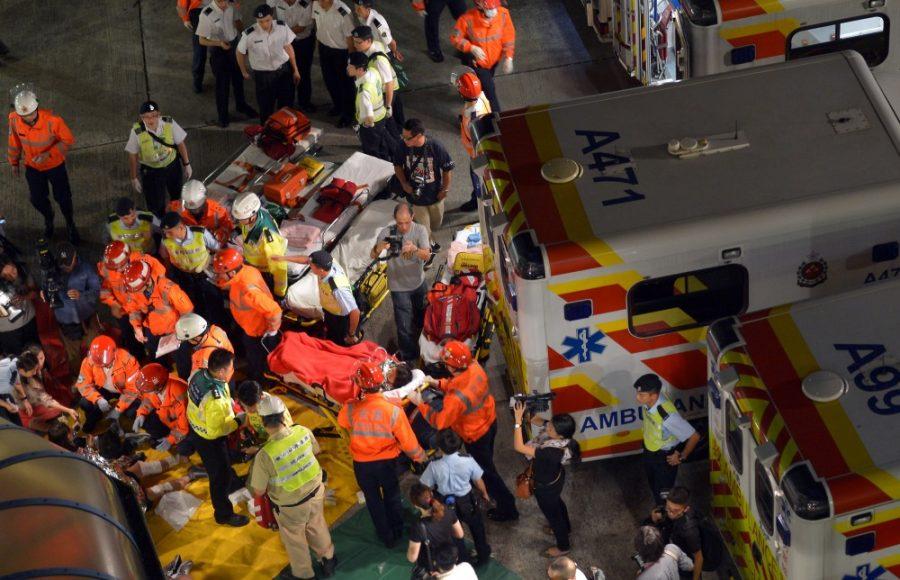Rescuers work to carry victims to hospitals after two vessels collided off the Lamma Island to the southwest of the Hong Kong Island in Hong Kong, south China, October 1, 2012. At least 25 people were killed when a ferry and tugboat collided. (Chen Xiaowei/Xinhua via Zuma Press/MCT)