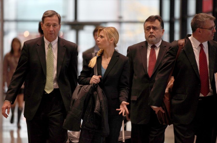 Karolina Obrycka, center, the bartender that former Chicago Police Officer Anthony Abbate beat up, and her lawyers exit the Dirksen U.S. Courthouse, Tuesday, October 23, 2012, in Chicago, Illinois. (Abel Uribe/Chicago Tribune/MCT)