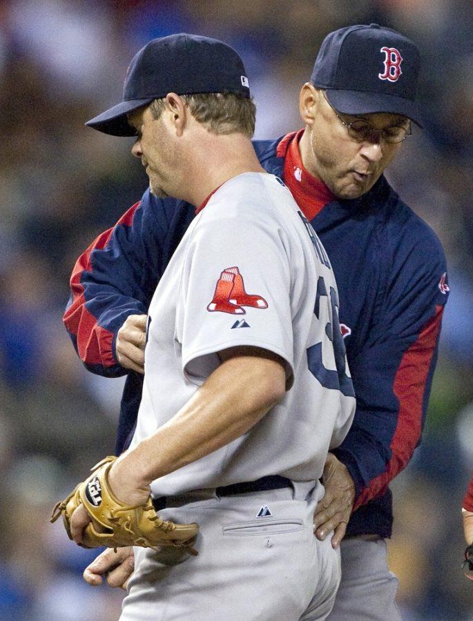 Boston Red Sox manager Terry Francona relieves starting pitcher Paul Byrd (36) in the seventh inning of a baseball game against the Kansas City Royals, Tuesday, September 22, 2009, at Kauffman Stadium in Kansas City, Missouri. (John Sleezer/Kansas City Star/MCT)