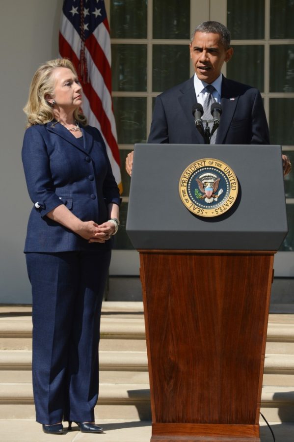 President Barack Obama delivers remarks beside Secretary of State Hillary Clinton, left, on the killing of US ambassador to Libya, Christopher Stevens, and three embassy staff, Wednesday, September 12, 2012, in the Rose Garden of the White House in Washington, D.C. Gunmen attacked the US consulate in Benghazi, killing Stevens and three others, late September 11, 2012, while another assault took place on the US embassy in Cairo. (Pool photo by Michael Reynolds/EPA via Abaca Press/MCT)