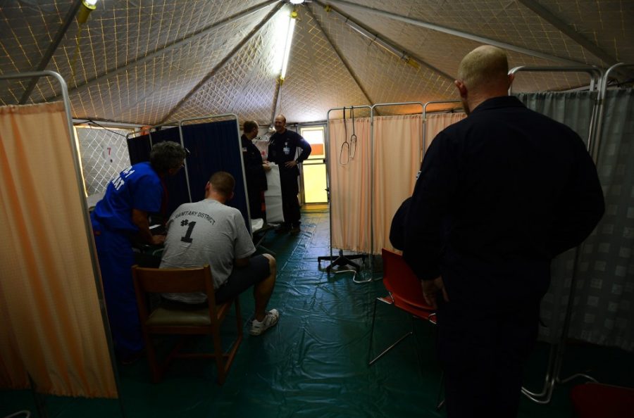 A man receives medical aid from Disaster Medical Assistance Teams (DMATs) from Washington in Oceanside, New York on Tuesday, November 6, 2012. (Karen Wiles Stabile/Newsday/MCT)