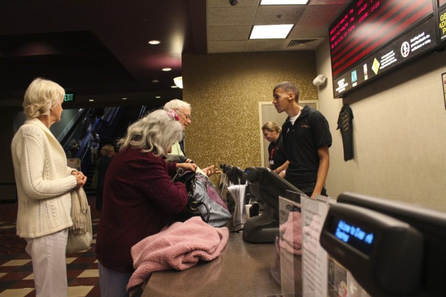 Robert Alcaraz / Arizona Daily Wildcat

Marcus Purry, a cashier at Century Park Place 20, assists movie attendees on Nov. 25.
