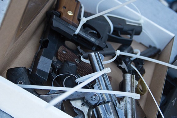 Guns in a box collected at the Midtown Tucson Police Station. TPD gave $50 Safeway giftcard in return for each gun.