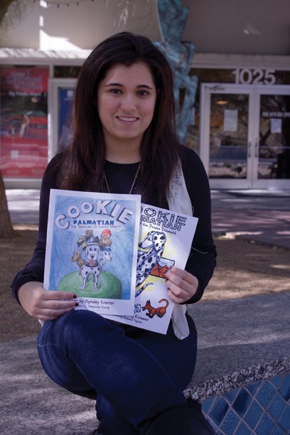 Jordin OConnor /  Arizona Daily Wildcat

Sydney Kramer and her two childrens books that she wrote.