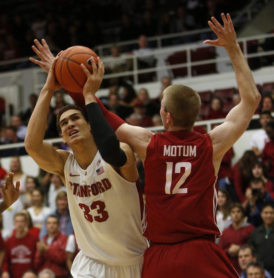 Stanford's Dwight Powell (33) tries to find a shooting lane against Washington State's Brock Motum (12) in the first half at Maples Pavilion in Stanford, California, on Wednesday, January 9, 2013. (Nhat V. Meyer/San Jose Mercury News/MCT)