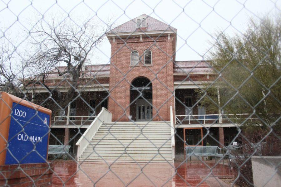 Fences go up around Old Main, visible construction to start next week