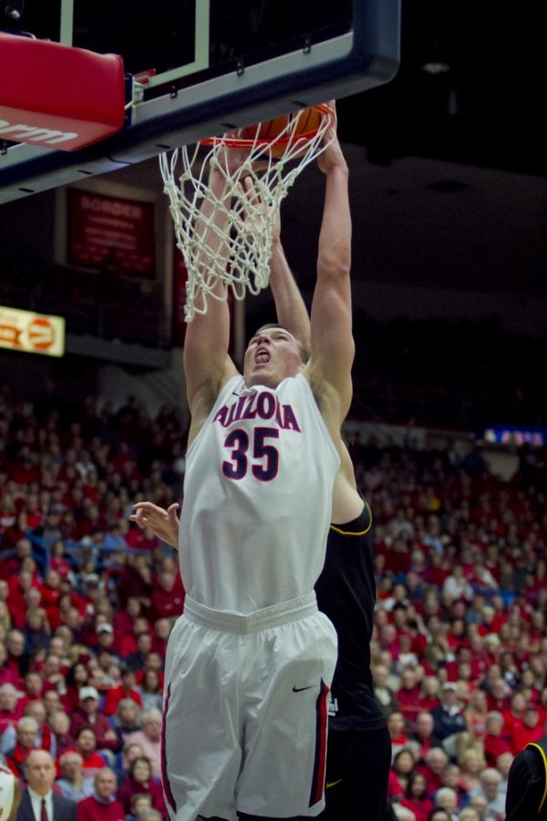 	Freshman center Kaleb Tarczewski dunks against ASU on Saturday, March 9, 2013. Arizona won the game 73-58 at McKale Center.