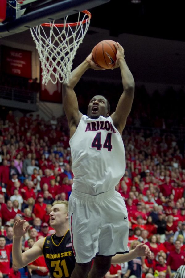 	Arizona Wildcats forward Solomon Hill dunks late in the second half against ASU on Saturday, March 9, 2013. Arizona won the game 73-58 at McKale Center.