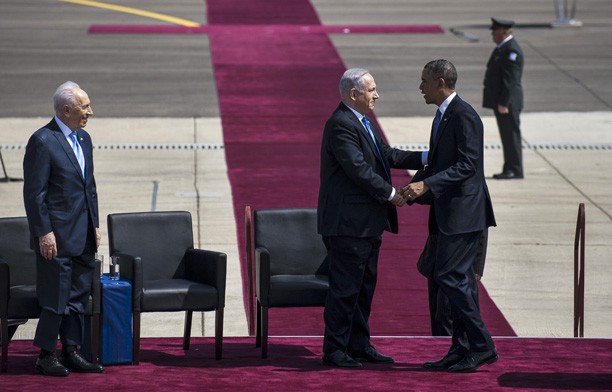 President Barack Obama is welcomed by Israeli President Shimon Peres (left) and Israeli Prime Minister Benjamin Netanyahu during a welcoming ceremony at the Ben-Gurion Airport near Tel Aviv, Israel, on March 20, 2013. Obama arrived in Tel Aviv in Israel Wednesday to start his first visit as U. S. president to Israel. Obama will spend three days in Israel, the Palestinian territories and Jordan. (Ahikam Seri/AA/Abaca Press/MCT)