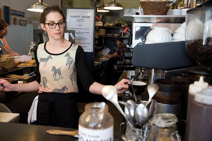 Tyler Besh/ Arizona Daily Wildcat

Tucson resident Cafe Passe barista, Kelsey Reinhard, makes a cappuccino for a morning customer. Sometimes people will be here at the beginning of my shift and when I clock out theyre still here.