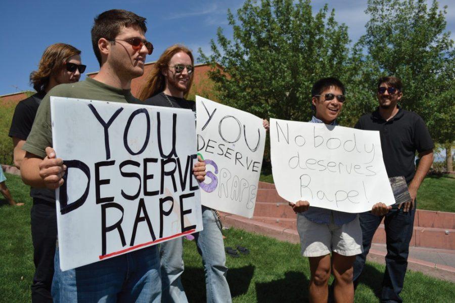 Ryan Revock /Arizona Daily Wildcat

Brother Dean Samuel (left), a classics and religious studies junior, preaches on rape at Heritage Hill on Tuesday afternoon and Josh Solomon (center), a computer science sophmore, as well as Gregor Orbino (right), a political science junior, serve as a counter point.  