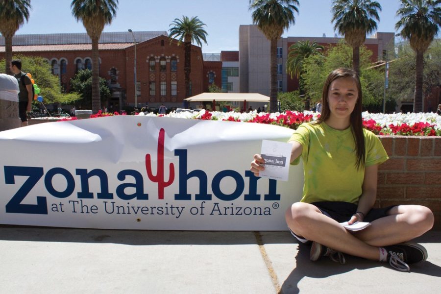Kaylee+Stepanski%2C+president+of+the+UA+chapter+of+Zonathon%2C+hands+out+flyers+on+the+UA+mall.+Zonathon+is+a+dance+marathon+fundraiser+that+benefits+Tucson+Medical+Center+for+Children.+