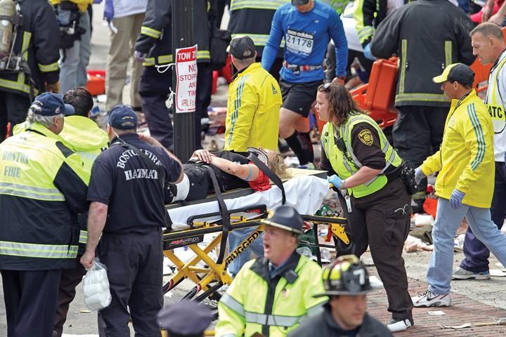 Emergency+personnel+assist+the+victims+at+the+scene+of+a+bomb+blast+during+the+Boston+Marathon+in+Boston%2C+Massachusetts%2C+Monday%2C+April+15%2C+2013.+%28Stuart+Cahill%2FBoston+Herald%2FMCT%29