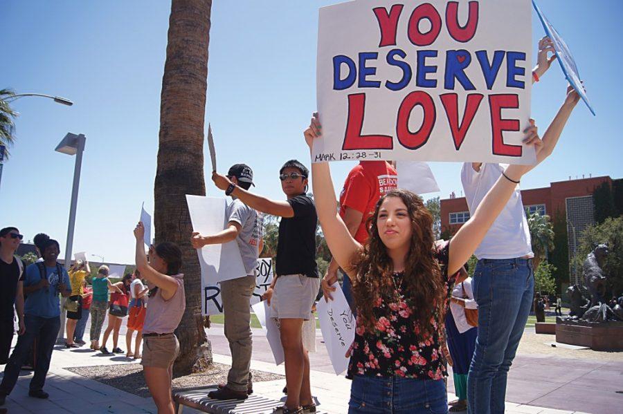 	Gabriela Diaz/Arizona Daily Wildcat 

	In response to another student’s controversial message, Paola Andrea Gonzalez, a pre-pharmacy sophomore, holds her own sign reading “You deserve love” on Tuesday. The Women’s Interests Collaborative organized a demonstration to counter UA student Dean Saxton’s “You deserve rape” sign, giving students an opportunity to spread positivity. 