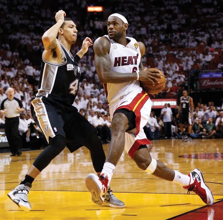LeBron James of the Miami Heat drives against San Antonio Spurs' Danny Green during the third quarter in Game 2 of the NBA Finals at the AmericanAirlines Arena in Miami, Florida, Sunday, June 9, 2013. The Miami Heat defeated the San Antonio Spurs, 103-84. (Al Diaz/Miami Herald/MCT)