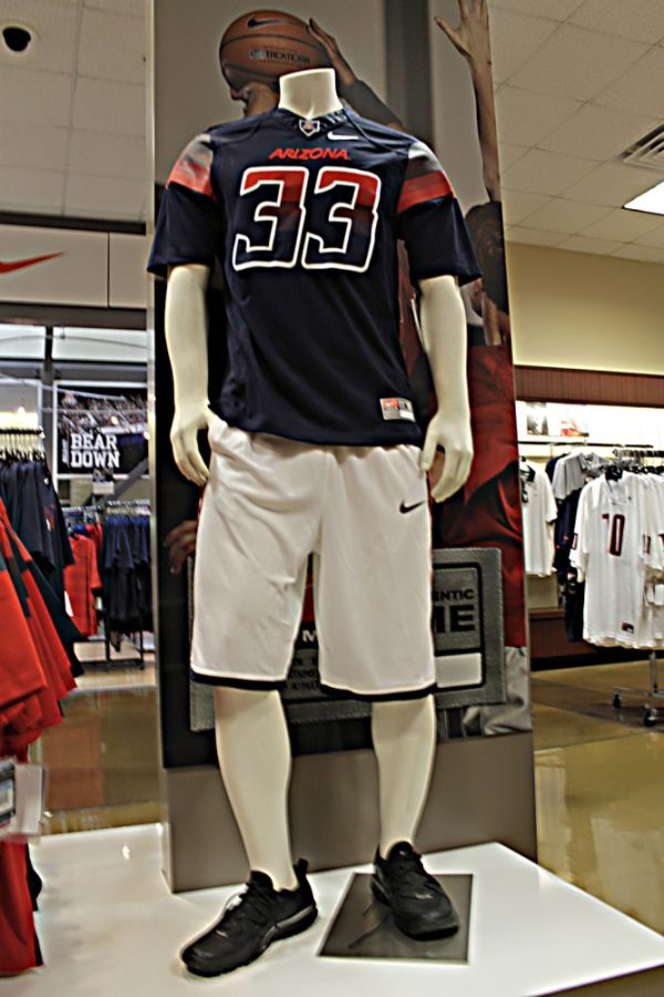 Briana+Sanchez+%2F+Arizona+Daily+Wildcat%0A%0AThe+new+UA+football+jerseys+are+now+being+sold+inside+the+bookstore+in+the+student+union.+The+navy+blue+jerseys+are+%24120+and+the+red+jerseys+are+%2490.+