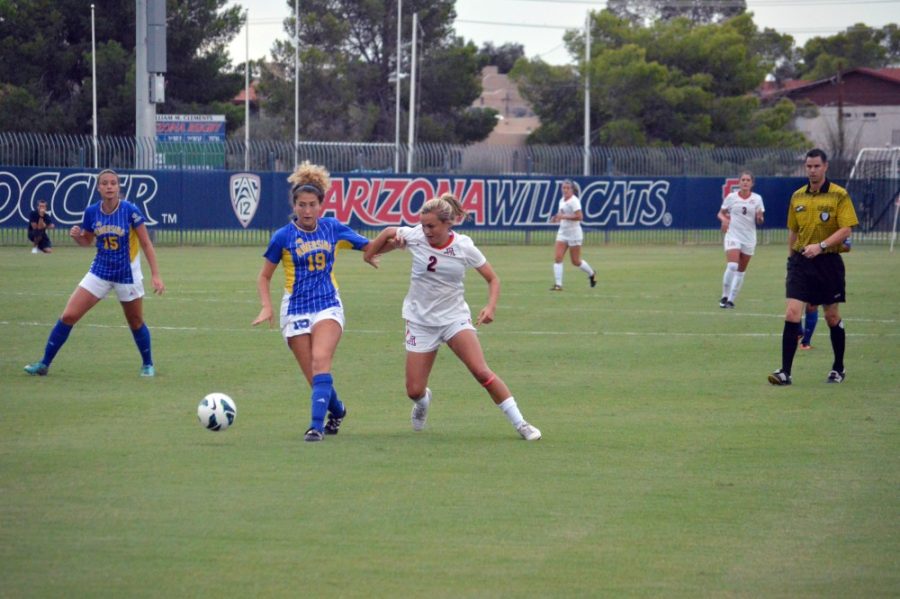 Brian Valencia / The Daily Wildcat

Alexandra Doller battles for the ball against UC Riverside on Friday, Aug. 30, 2013. 