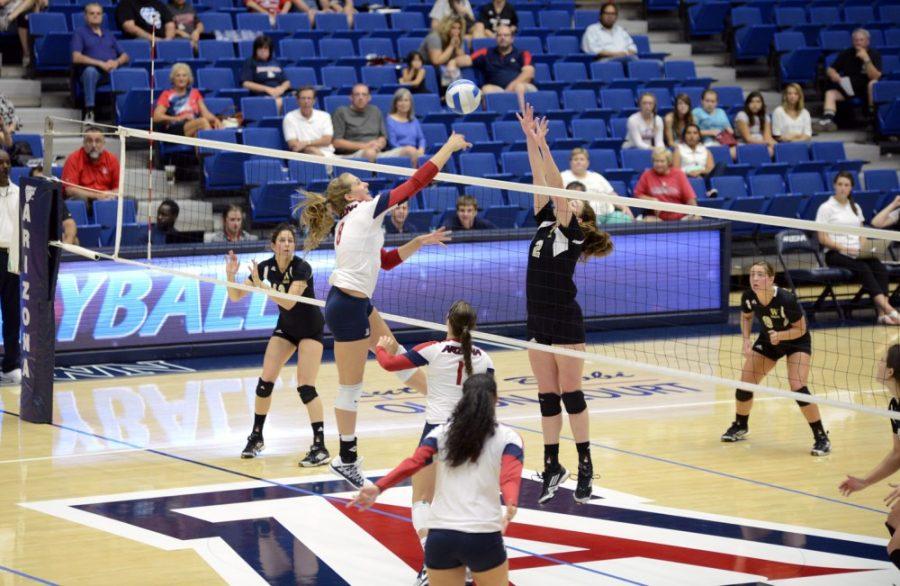 Ryan Revock / The Daily Wildcat

Rachel Rhoades spikes the ball against Wofford on Sept. 21, 2013.

