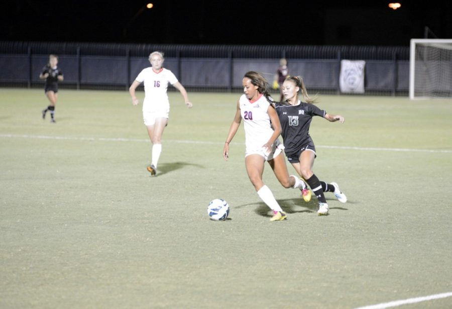 	Ryan Revock/The Daily Wildcat

	Alexa Montgomery (left) defends the ball against Hawaii’s Kama Pascua (right) on Sept. 20, 2013.