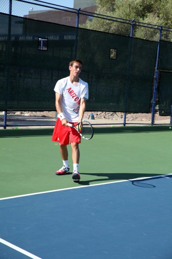 Shane+Bekian+%2F+The+Daily+Wildcat%0A%0AMatt+Dunn%2C+a+Pre-Business+sophomore%2C+serves+the+ball+to+his+teammate+during+the+Mens+Tennis+Team+practice+on+Friday.+