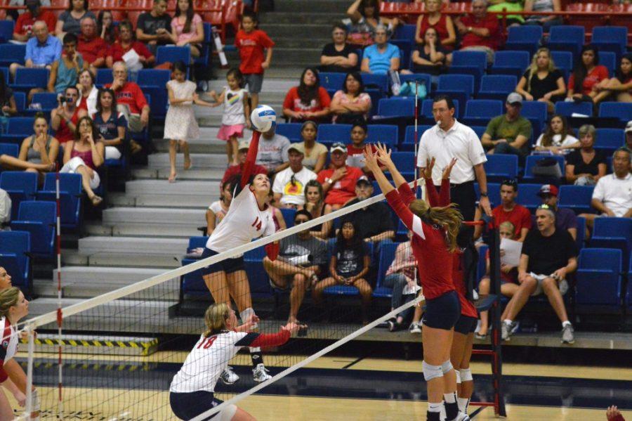 Brian Valencia/ Arizona Daily Wildcat

Taylor Arizobal spikes the ball at the volleyball scrimmage on Saturday, Aug. 24, 2013. 
