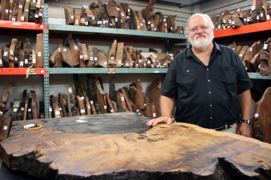 Michaela Kane /  Arizona Daily Wildcat

Thomas Swetnam, Director of the University of Arizona Bryant Bannister Laboratory of Tree Ring Research and a Regents Professor at the UA, poses with a collection of tree samples stored in the UA lab on Monday, Aug. 26, 2013. Using the tree rings from these core samples, researchers are able to investigate levels of past forest fires. 