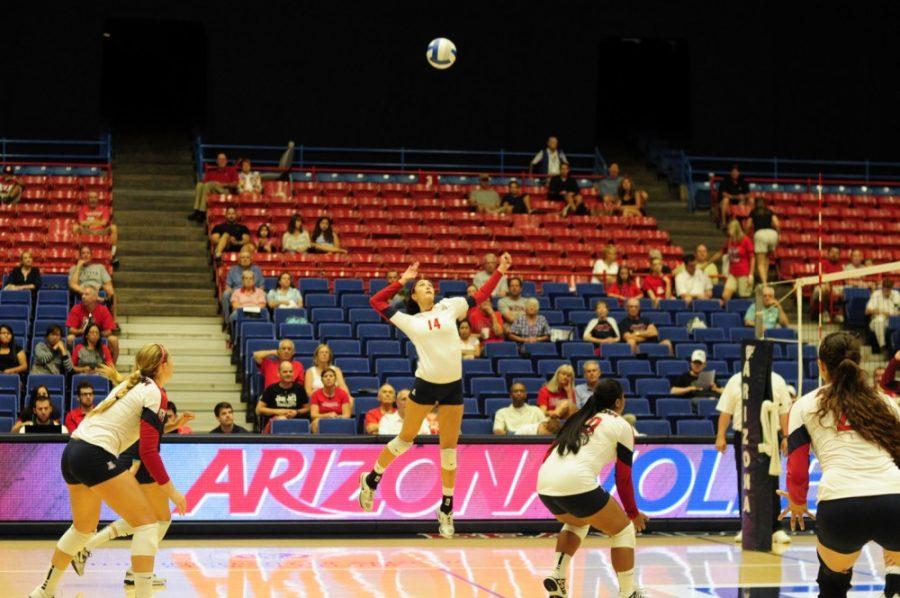 UA outside hitter Taylor Arizobal goes to spike the ball against EKU on  Saturday, Sept. 7, 2013.  