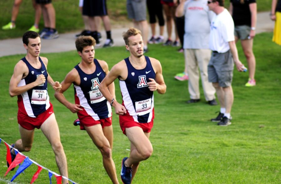 Tyler Baker / The Daily Wildcat

Sam Macaluso (left), Thomas Valente (center) and Brandon Timpe (right) run in the Dave Murray Invitational on Sept. 20, 2013 in Tucson.  
