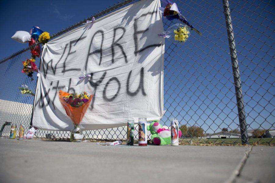 A message hangs behind Sparks Middle School near the basketball courts where two students where injured and teacher Michael Landsberry was killed in a shooting, on Tuesday, October 22, 2013, in Sparks, Nevada. The police department said they will not release the name of the 12-year-old shooter, who killed himself on Monday. (Hector Amezcua/Sacramento Bee/MCT)