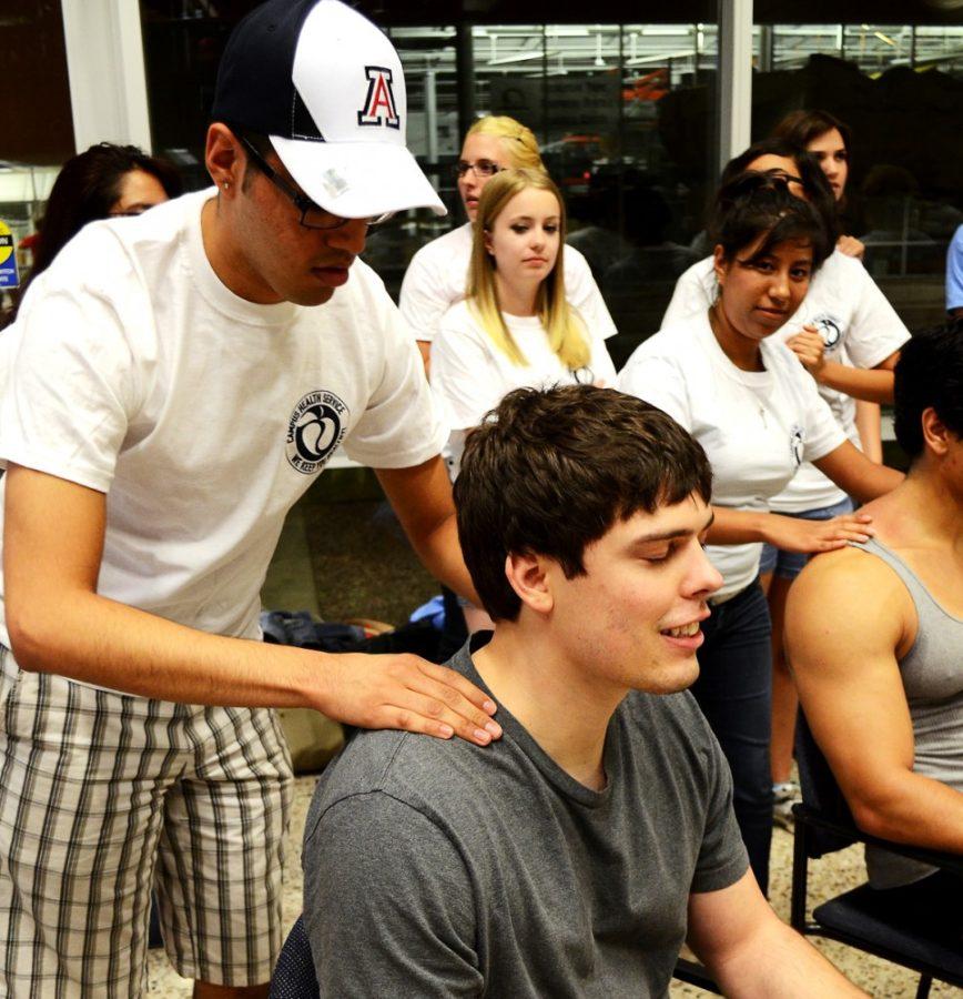 Grace Pierson/ Arizona Daily Wildcat

UA graduate William Bodman enjoys a free massage from the Stressbusters on Thursday night at the Rec Center.