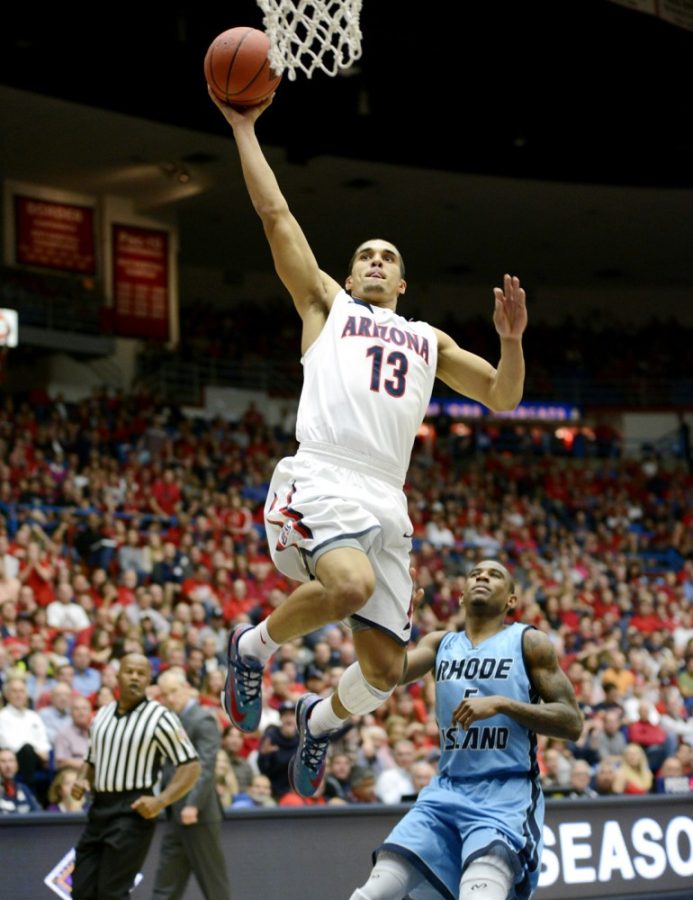 Ryan+Revock+%2F+The+Daily+Wildcat%0A%0AUA+junior+guard+Nick+Johnson+jumps+to+dunk+the+ball+against+Rhode+Island+Tuesday+at+the+McKale+Center.++Arizona+defeated+Rhode+Island+87-59.%0A%0A