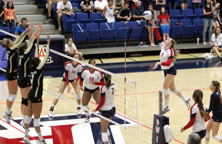 Amy Phelps / The Daily Wildcat

UA junior outside hitter Madi Kingdon spikes the ball against Colorado on Nov. 17 at the McKale Center.  