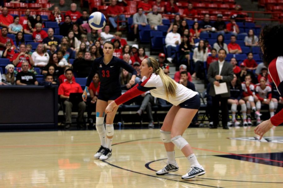 Rebecca Marie Sasnett / The Daily Wildcat

UA junior outside hitter Madi Kingdon digs the ball during the volleyball game against ASU Friday, Nov. 29 at the McKale Center. 