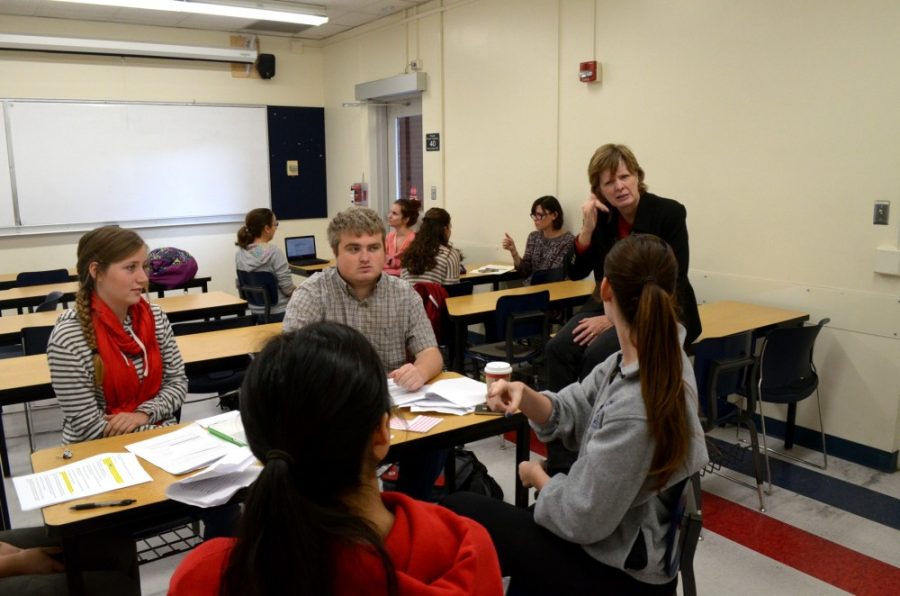 Grace Pierson / The Daily Wildcat

Professor Cindy Volk communicates with her students via sign language while they work in groups on Dec. 2 in the Psychology Building. Pictured clockwise from left: Nicole Handorf, Derek Evans, Alison Fishman, and Shelby Yuen.