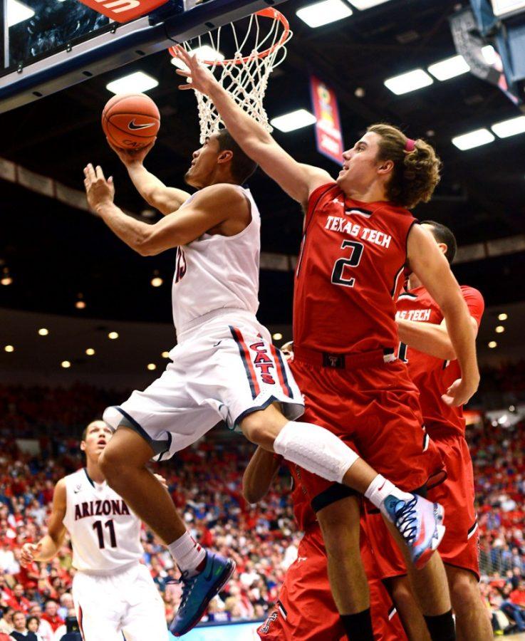 Tyler+Baker+%2F+The+Daily+Wildcat%0A%0AUA+junior+guard+Nick+Johnson+goes+in+for+a+layup+against+Texas+Tech+on+Tuesday+at+the+McKale+Center.