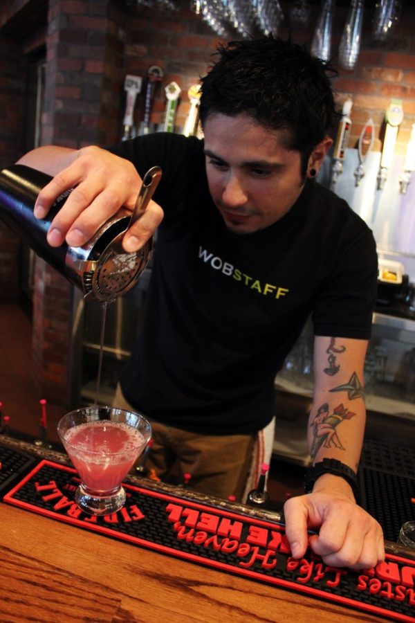 Savannah Douglas/ The Daily Wildcat

Austin Sanchez is currently a bartender at the World of Beer. He has been at this bar since its grand opening in October. 