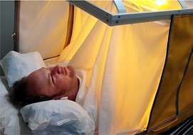 Courtesy of Charles Raison

A participant lies in a tent that elevates his core body tempature using infrared heat. Preliminary data suggests that the treatment is effective at reducing symptoms of depression. 