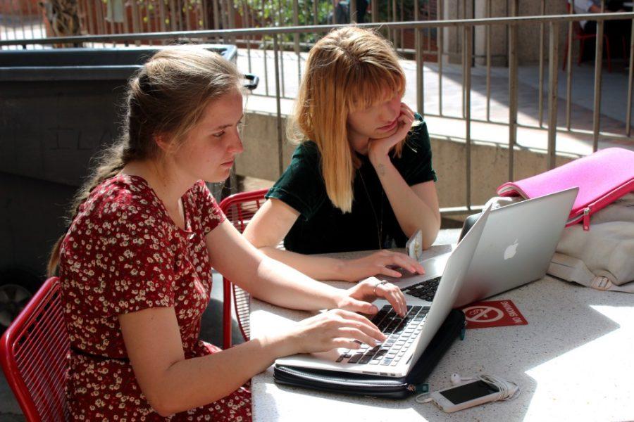 Kimberly Cain / The Daily Wildcat

Dana Pattison (left), creative writing sophomore, and Maya Heilman-hall (right), photography sophomore, work on french homework outside the UA library on Monday.