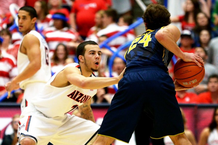 Tyler Baker/ The Daily Wildcat

Sophomore guard Gabe York puts pressure on Cal redshit junior guard Ricky Kreklow during Arizonas 87-59 win over Cal at McKale Center on Wednesday.