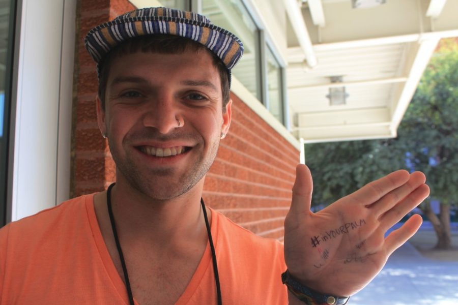 Joey Fisher / The Daily Wildcat

Nicolas Alexandre, the president of the UA Palm Oil Awareness Initiative, displays his #inyourpalm for the photo petition. 