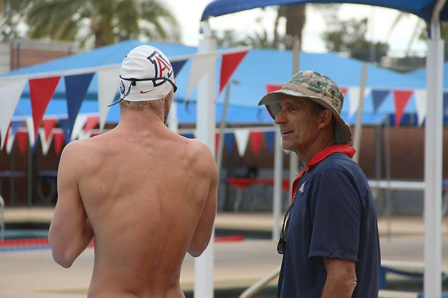 Mark Armao/The Daily Wildcat 

Rick DeMont (right) talks with junior Kevin Cordes (left). DeMont, the first man to break the four-minute barrier in the 400m freestyle, was named head swimming and diving coach for UA on Tuesday. 