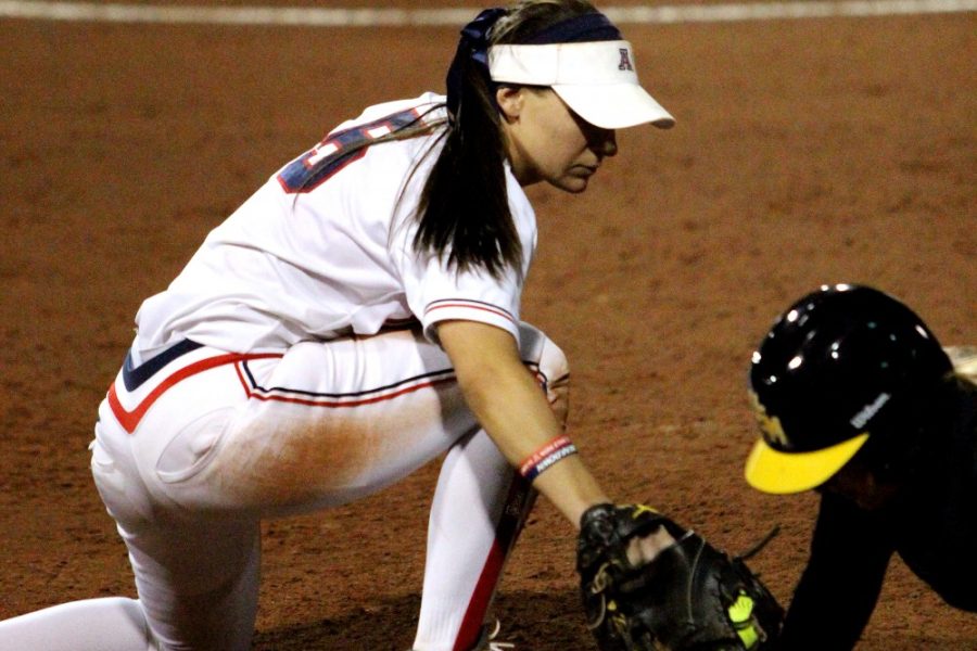 Cecilia Alvarez/ The Daily Wildcat

Junior utility Hallie Wilson tags Southern Mississippi's player during UA's first game of the season against Southern Mississippi at Hillenbrand Memorial Stadium on Friday. UA won 9-0.

