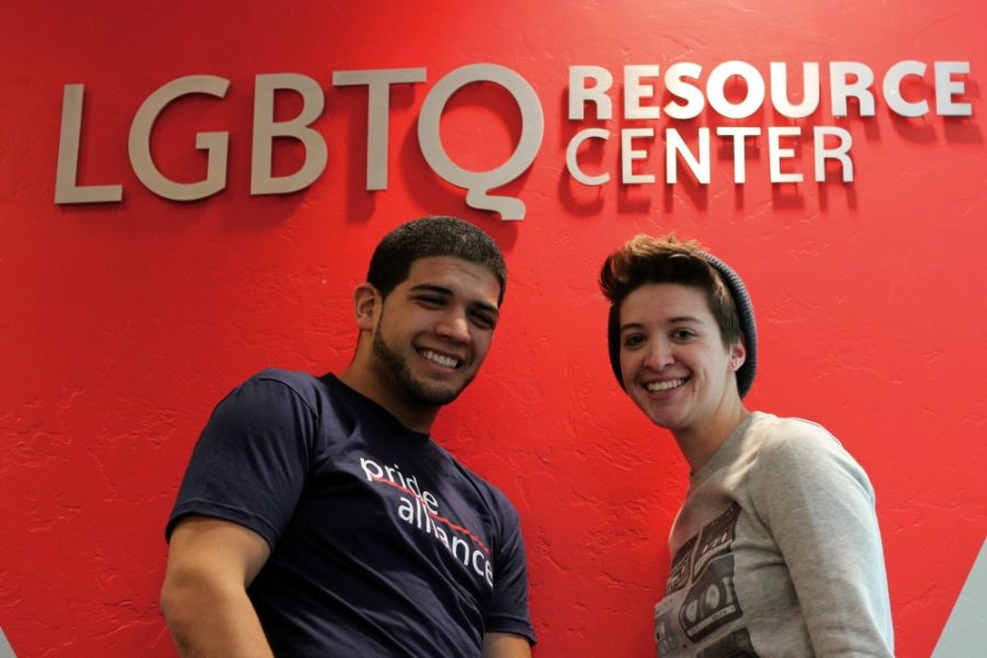 Juan Pereyra and Katie Kilby stand outside of the LGBTQ resource center. Pereyra is an internship coordinator for the resource center and Kilby is the pride alliance co-director. 