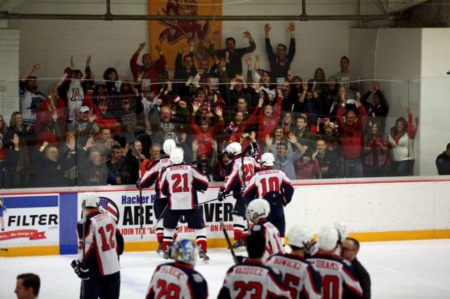 Arianna+Grainey%2F+The+State+Press%0A%0AThe+Arizona+hockey+team+celebrates+with+fans+after+their+2-1+win+against+ASU+at+Oceansude+Ice+Arena+on+Saturday.